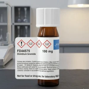 A small amber glass chemical bottle of Dimidium bromide Chemical with a white cap and a prominent white label, centered against a blurred, modern laboratory background.