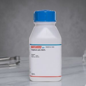 Front view of Kimyai Mercuric Acetate Chemical product sulphuric acid bottle with blue cap on laboratory countertop beside glassware and tools